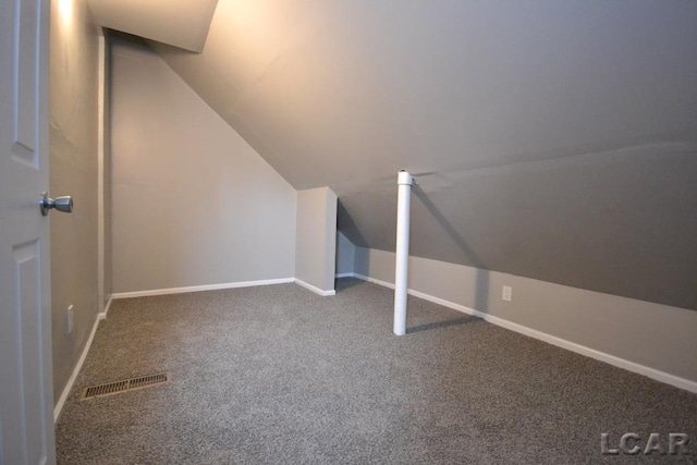 bonus room featuring lofted ceiling and carpet