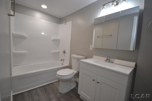 full bathroom with toilet, vanity, hardwood / wood-style floors, and shower / bathtub combination