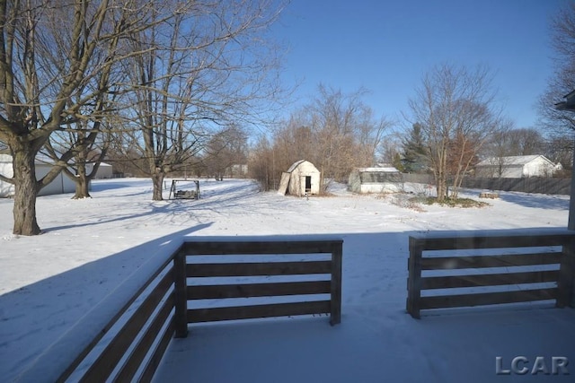 view of yard covered in snow