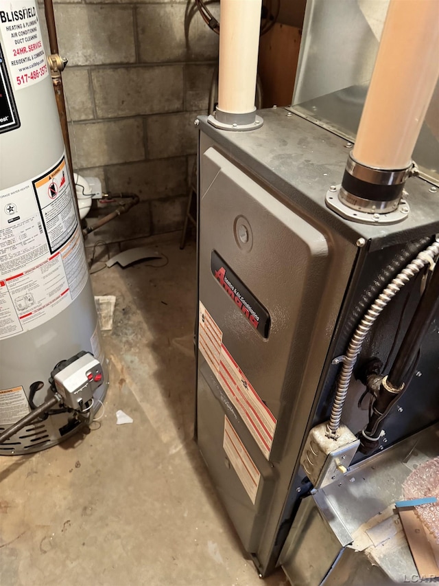 utility room featuring heating unit and water heater