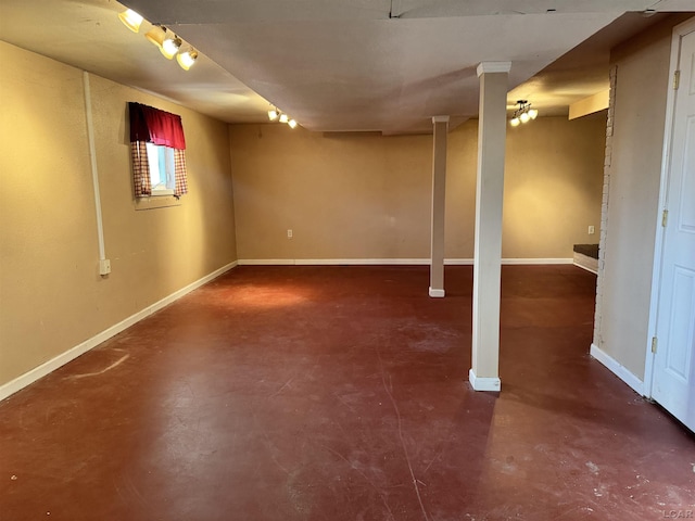 basement featuring rail lighting