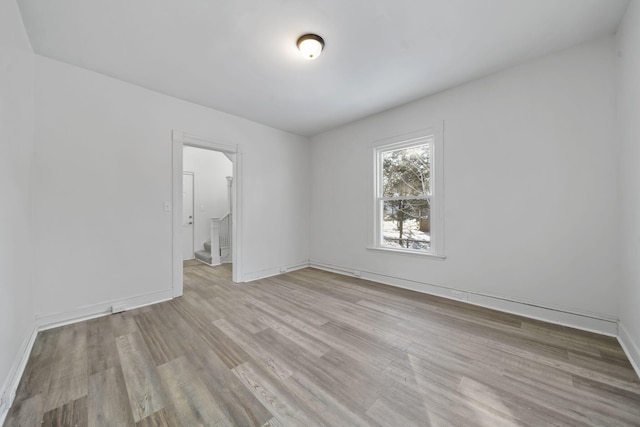 spare room featuring light hardwood / wood-style floors