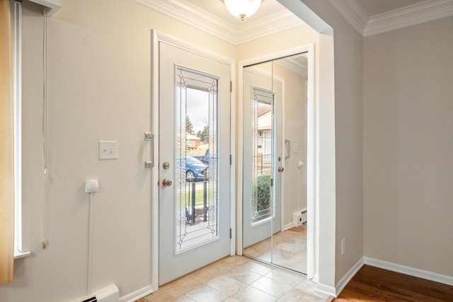 entrance foyer featuring a baseboard radiator and ornamental molding