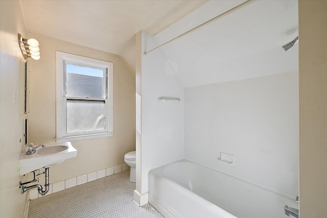 bathroom featuring tile patterned flooring and toilet