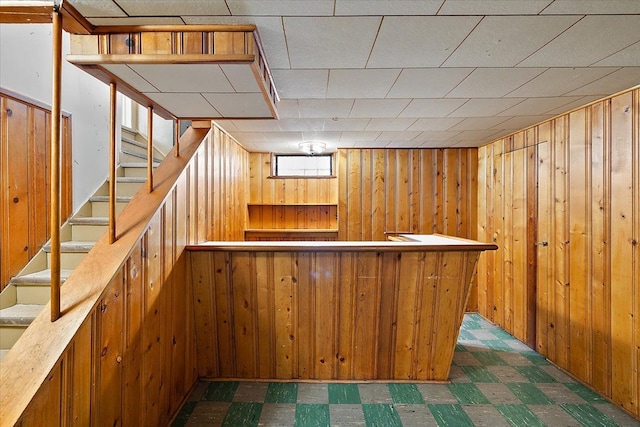 bar featuring wooden walls