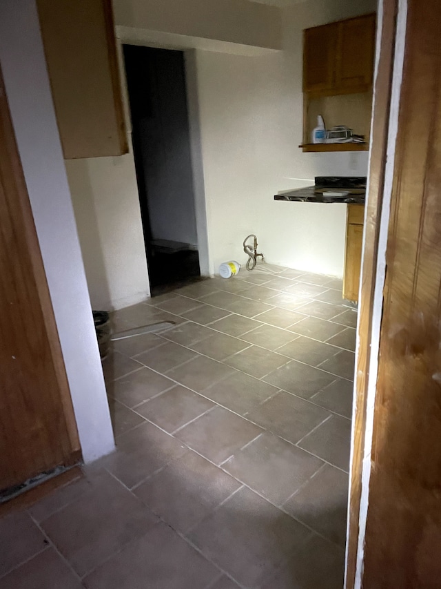 corridor with tile patterned flooring