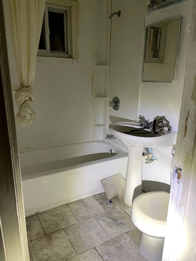 bathroom with toilet and shower / washtub combination