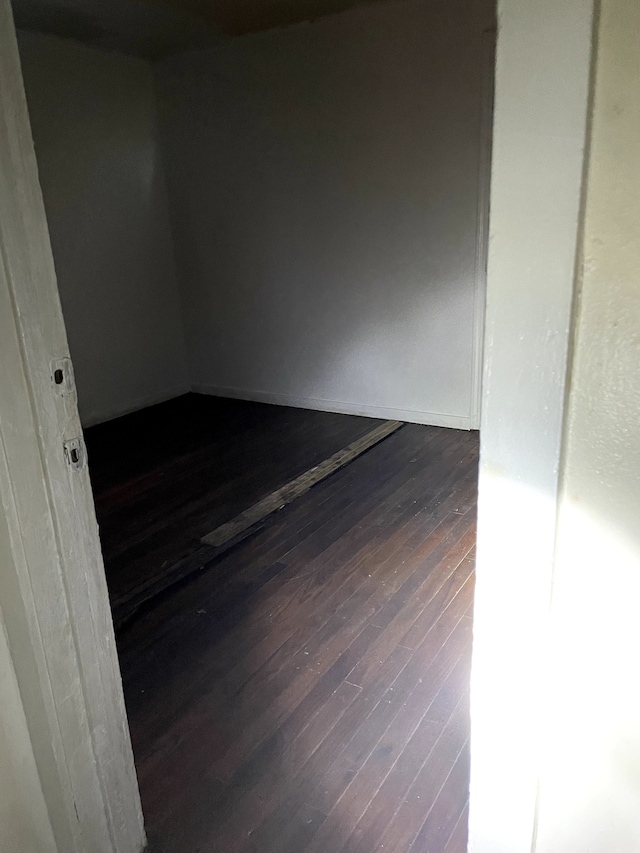 spare room with dark hardwood / wood-style floors