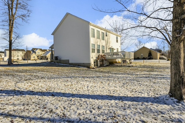 view of property exterior featuring a deck