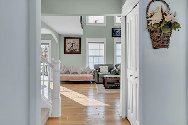 hallway with light hardwood / wood-style floors