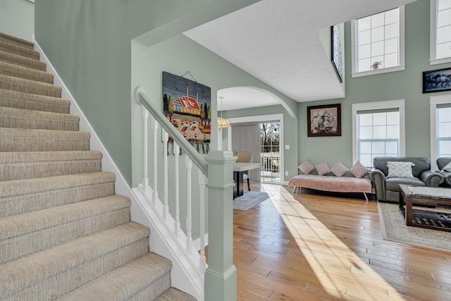 stairway with hardwood / wood-style floors