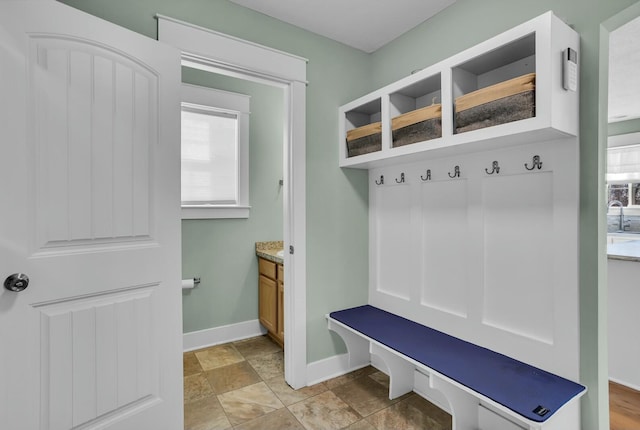 mudroom with a wealth of natural light and sink