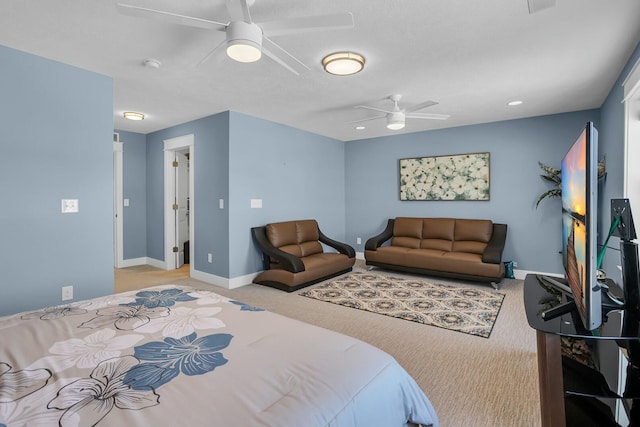 bedroom with ceiling fan and light colored carpet