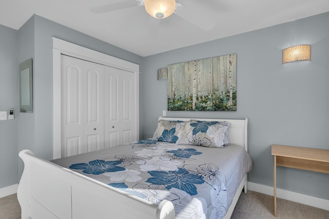 bedroom featuring ceiling fan, a closet, and carpet floors