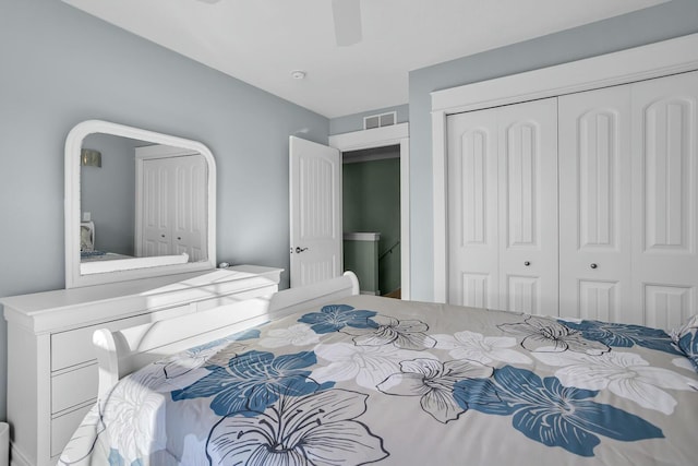 bedroom featuring ceiling fan and a closet