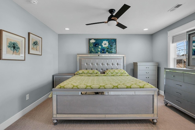 bedroom featuring ceiling fan and carpet