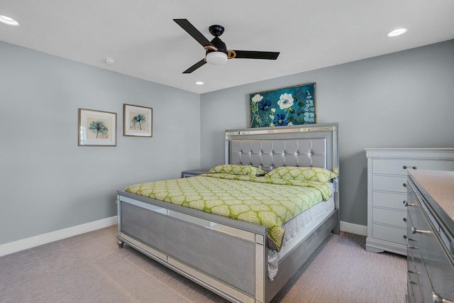 bedroom with ceiling fan and light colored carpet