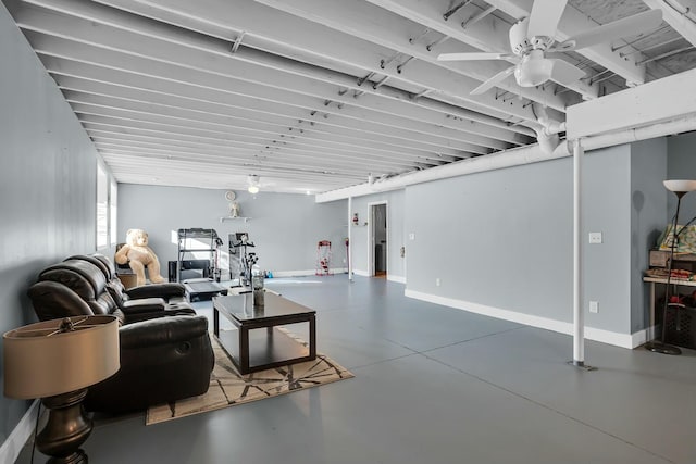 living room featuring concrete flooring and ceiling fan