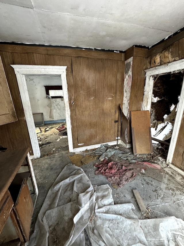 miscellaneous room featuring wooden walls