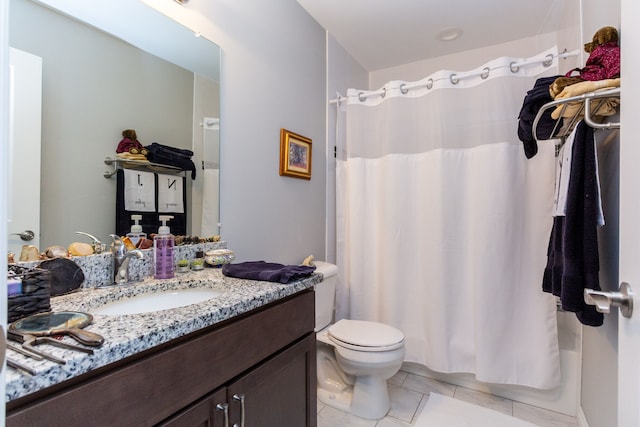 full bathroom featuring tile patterned floors, vanity, toilet, and shower / tub combo with curtain