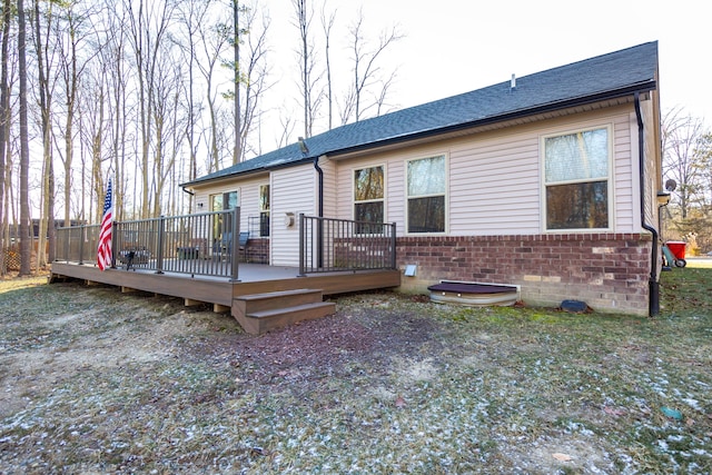 back of property with a deck