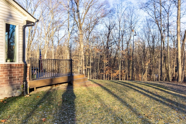 view of yard with a wooden deck