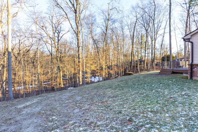 view of yard with a wooden deck