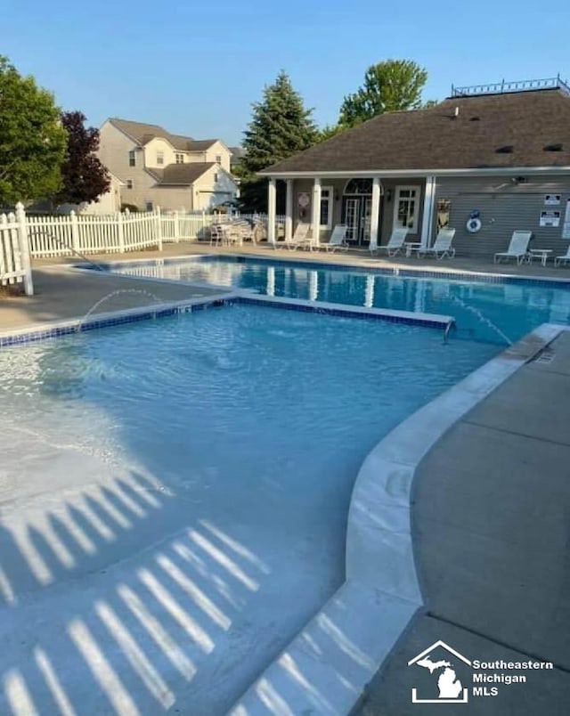 view of swimming pool with a patio area