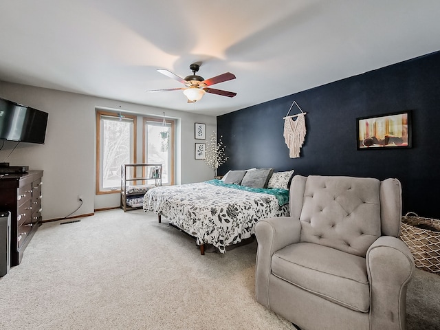 carpeted bedroom with ceiling fan