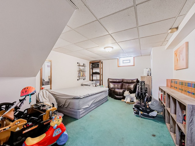 bedroom featuring a paneled ceiling and carpet