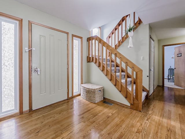 entryway with hardwood / wood-style flooring and a wealth of natural light