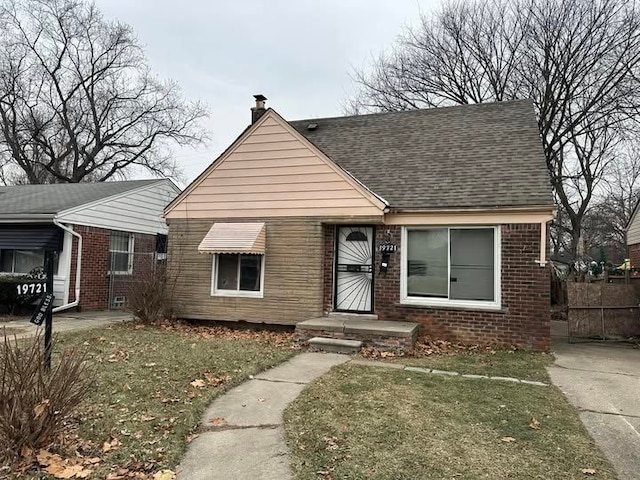 bungalow with a front yard