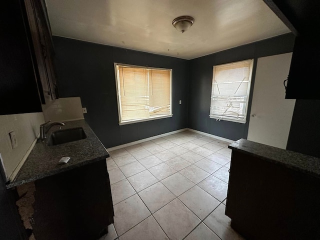 dining room with light tile patterned floors and sink