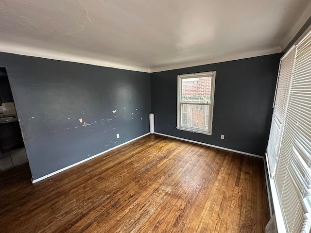 unfurnished bedroom featuring hardwood / wood-style flooring