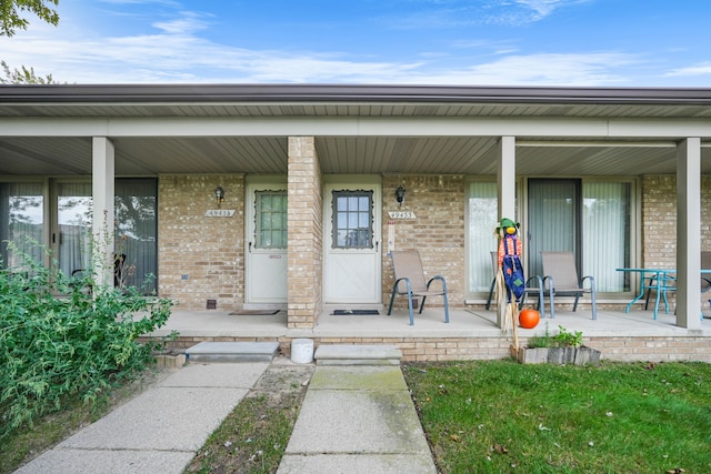 property entrance featuring covered porch