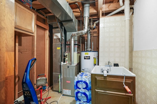 utility room featuring sink and water heater