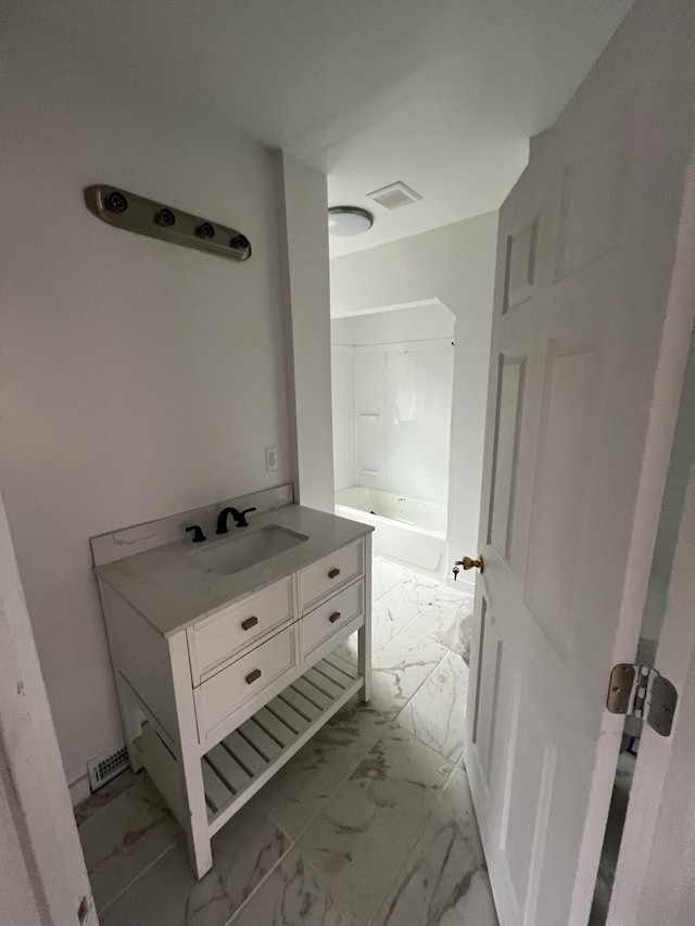 bathroom featuring vanity and tub / shower combination