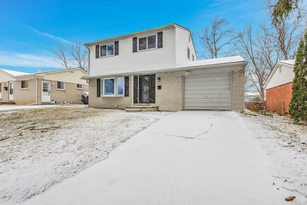 front of property with a garage