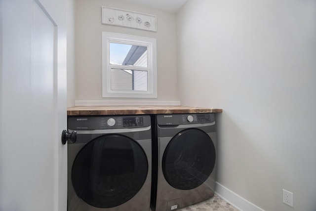 washroom with washing machine and dryer