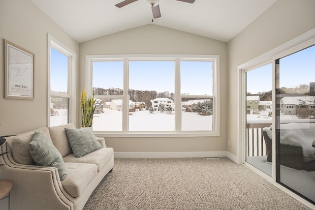 sunroom / solarium with ceiling fan and lofted ceiling