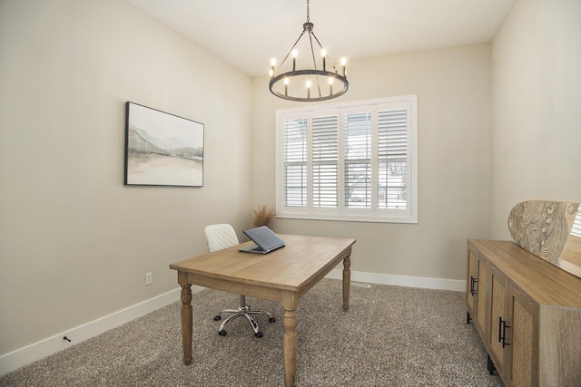 office with light colored carpet and a chandelier