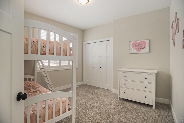 bedroom featuring a closet and light colored carpet