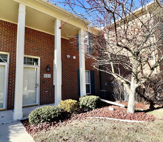 view of exterior entry with a porch