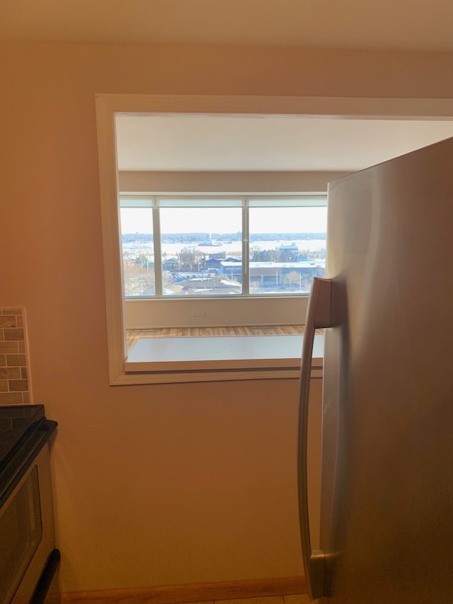 interior space featuring stainless steel fridge