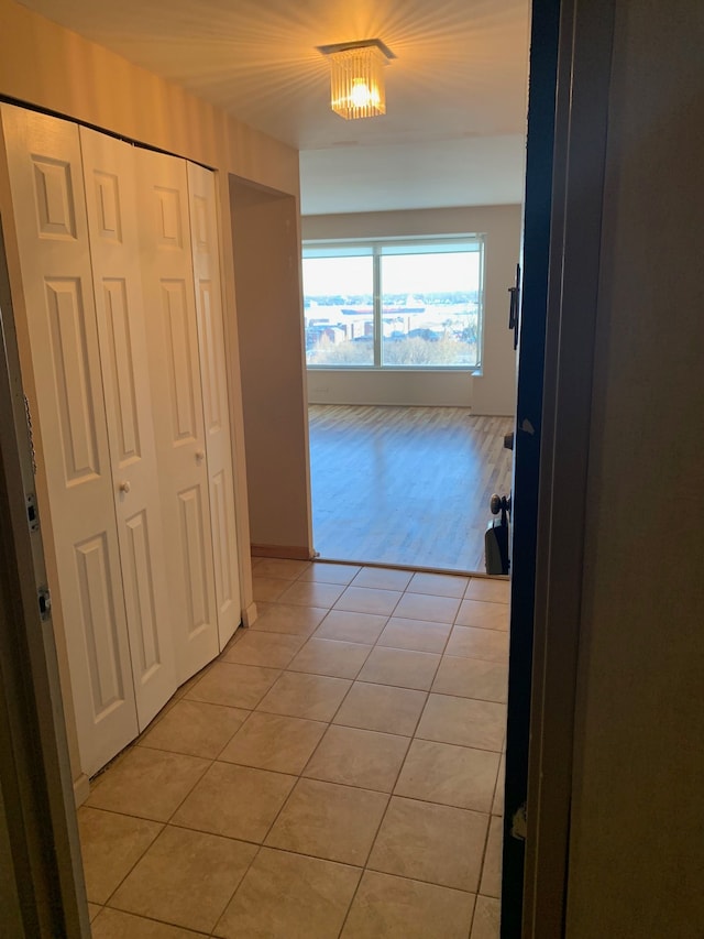 hallway featuring light tile patterned flooring