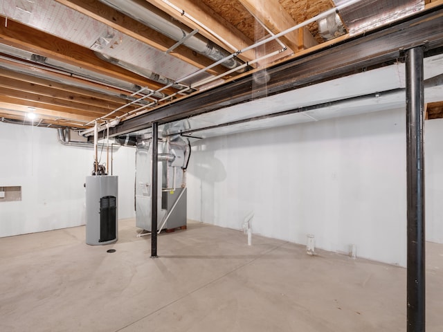 basement featuring heating unit and gas water heater