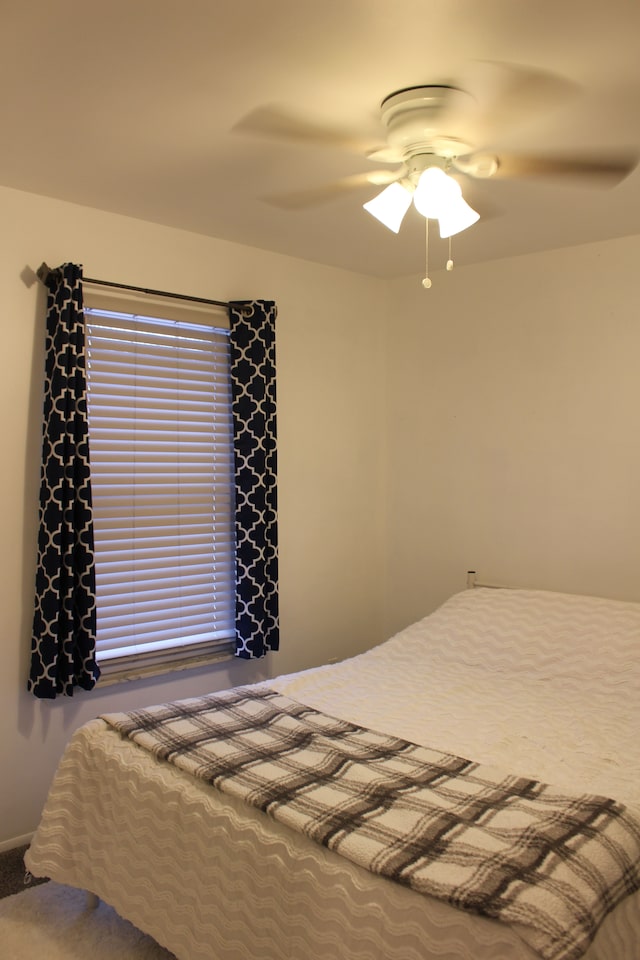 bedroom featuring ceiling fan