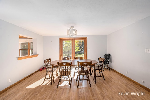 dining area featuring light wood-type flooring