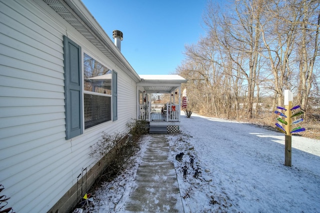 view of snow covered property