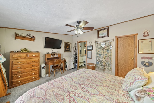 carpeted bedroom with ceiling fan, crown molding, and a textured ceiling